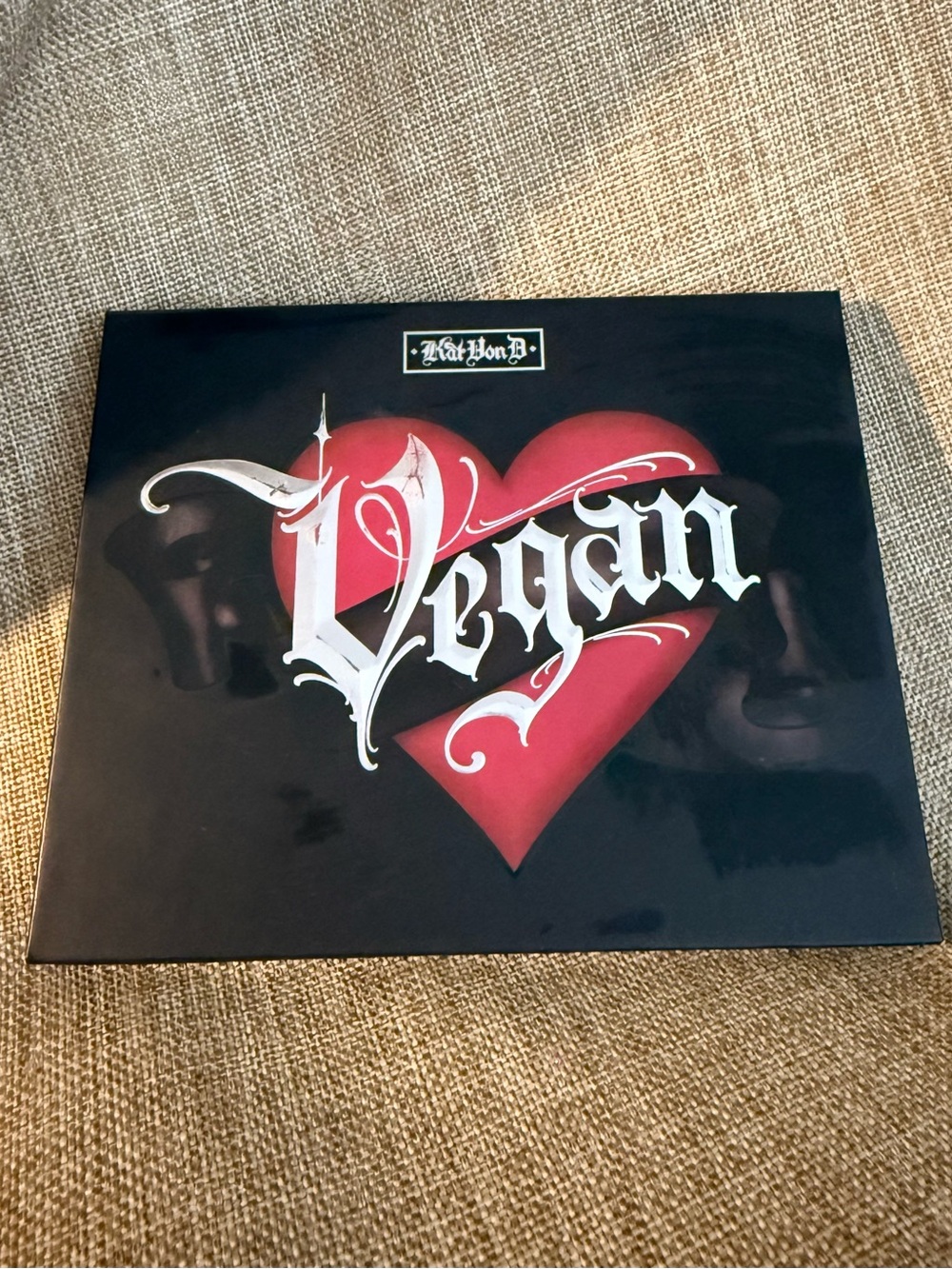 Kat Von D Black Palette with Red Heart and White Gothic Text